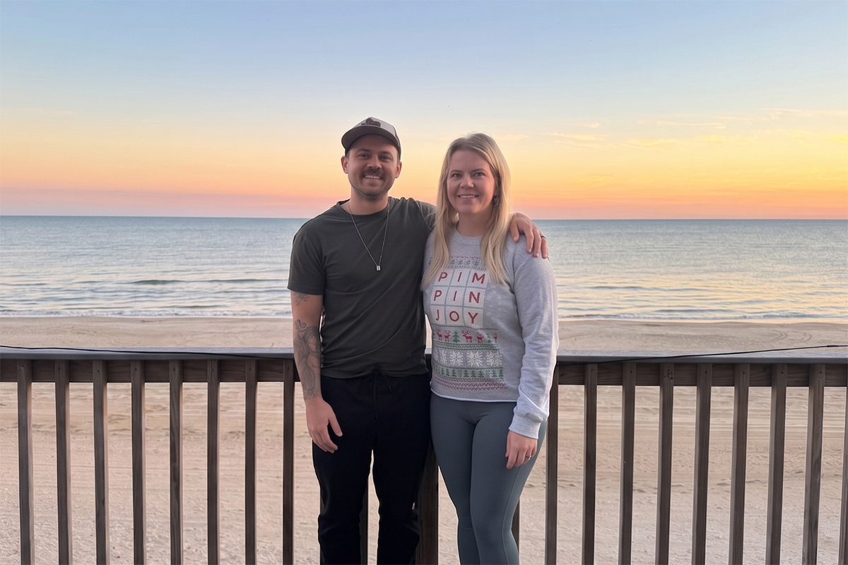 Felipe and Julie Caldeira on a deck overlooking Bolivar Peninsula beach