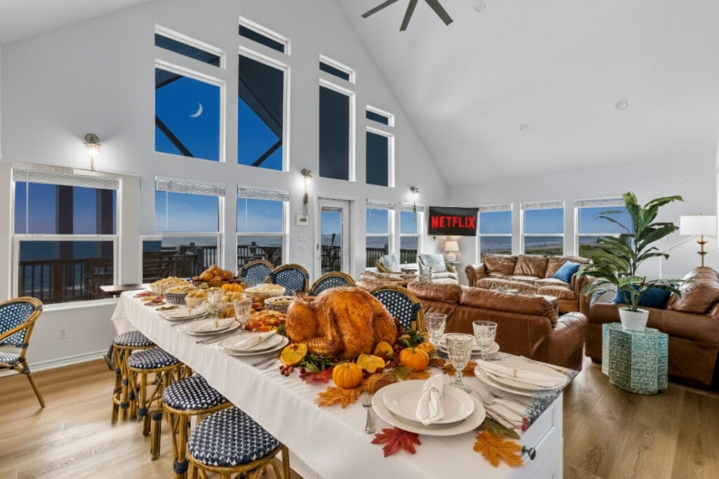 Thanksgiving dinner table set in a beachfront vacation rental with ocean view windows, Crystal Beach Texas